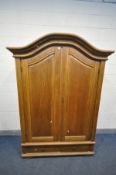 A MODERN STAINED OAK TWO DOOR CUPBOARD, with arched top, three internal shelves and two drawers,