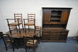 A REPRODUCTION OAK DINING SUITE, comprising an oak oval gate leg table, open length 168cm x closed