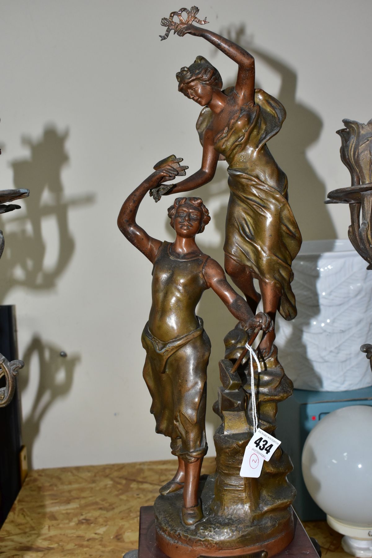 AN EARLY 20TH CENTURY BRONZED SPELTER AND ROUGE MARBLE CLOCK GARNITURE, the clock with figural - Image 4 of 10