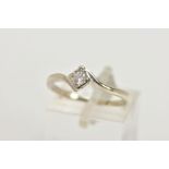 A 9CT GOLD DIAMOND SOLITAIRE RING, a single round brilliant cut diamond set in a four prong illusion