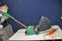 A BLACK AND DECKER GD200 LAWNRAKER with collection bag (PAT pass and working)