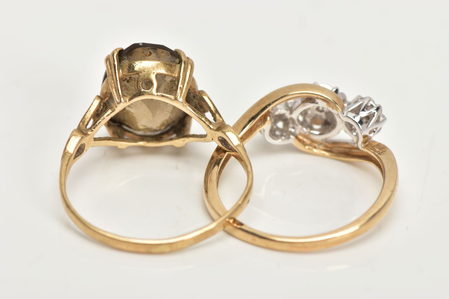 TWO 9CT GOLD RINGS, an oval cut stone assessed as Smokey quartz, prong set in a yellow gold, leading - Image 4 of 4