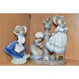 A LLADRO FIGURE GROUP AND A LLADRO FIGURE, comprising A Stitch In Time, no.5344, sculpted by