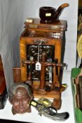 AN OAK PIPE SMOKERS CABINET WITH ART NOUVEAU METAL PANEL INSET TO DOOR, together with smoking