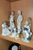 EIGHT NAO PORCELAIN FIGURES OF CHILDREN AND ANIMALS, including a girl in a nightdress covering a