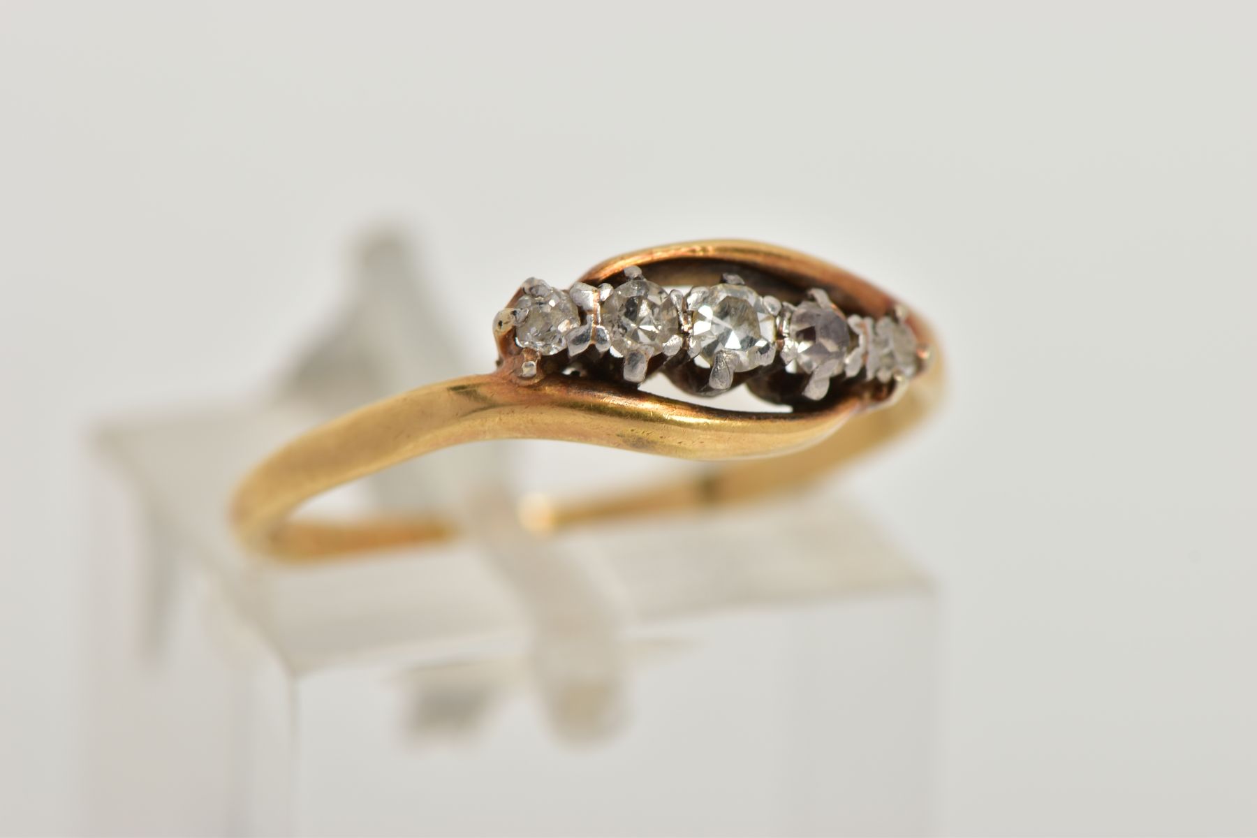 A YELLOW METAL FIVE STONE DIAMOND RING, designed with a row of graduating single cut diamonds, - Image 4 of 4