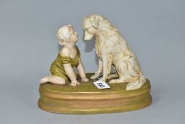 A ROYAL DUX FIGURE OF A BABY AND A SEATED DOG ON AN OVAL BASE INDISCTINCTLY STAMPED 'CAN'T YOU