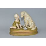 A ROYAL DUX FIGURE OF A BABY AND A SEATED DOG ON AN OVAL BASE INDISCTINCTLY STAMPED 'CAN'T YOU