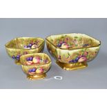 AN AYNSLEY ORCHARD GOLD GRADUATED SET OF THREE SHAPED SQUARE PEDESTAL BOWLS, ribbed gilt top rim and