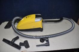 A MIELE C3 COMPACT VACUUM CLEANER with various attachments (PAT pass and working)