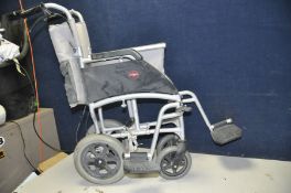 A DRIVE MOBILITY ENIGMA WHEELCHAIR with footrests