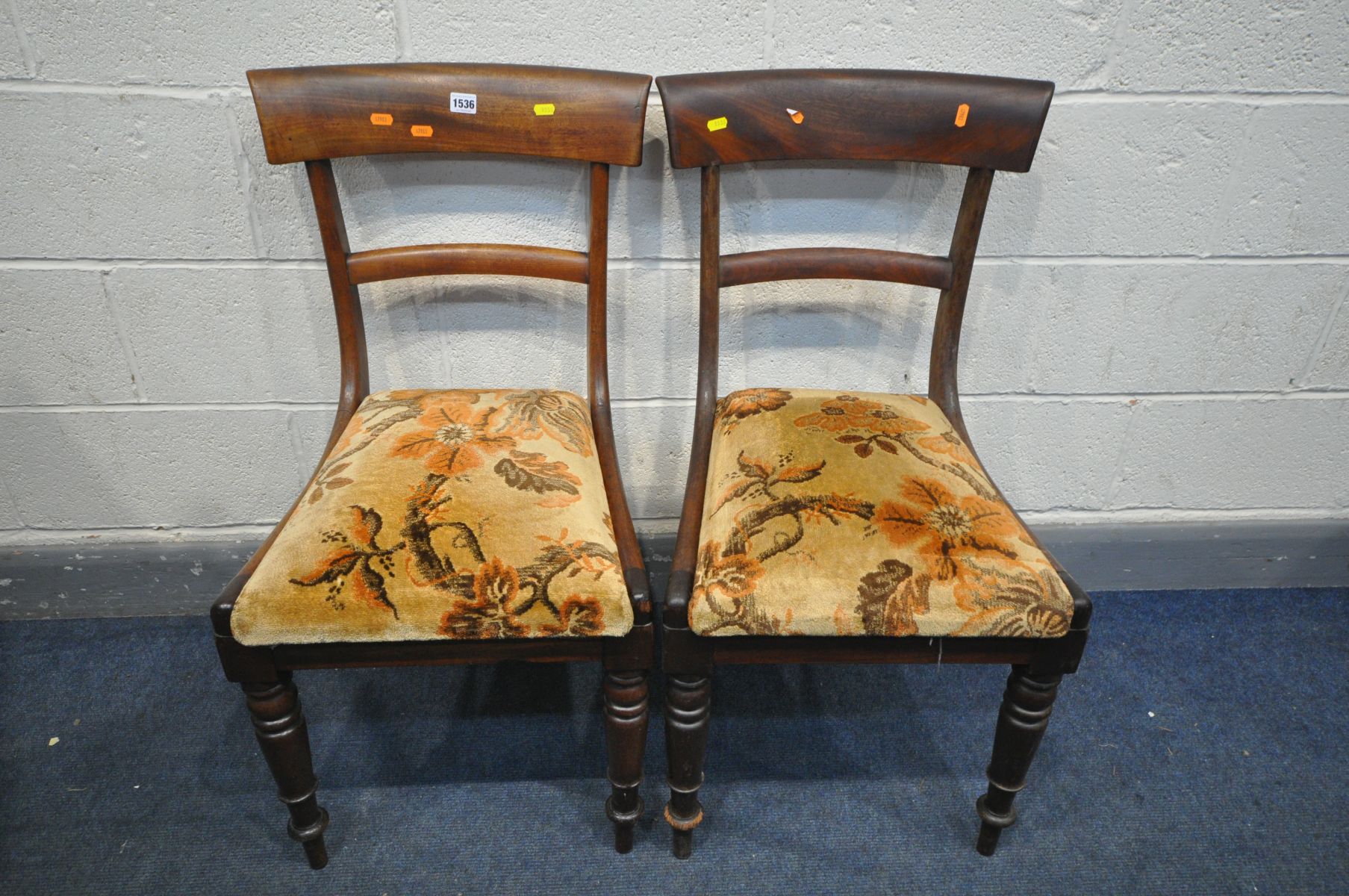 A PAIR OF REGENCY MAHOGANY BAR BACK CHAIRS, with floral upholstered seat pads, turned front legs (