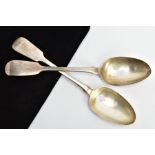 TWO MID-VICTORIAN SERVING SPOONS, fiddle pattern serving spoons, each with worn engravings to the