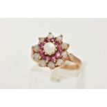 A 9CT GOLD RUBY AND OPAL CLUSTER RING, tiered cluster set with a central circular opal cabochon to a