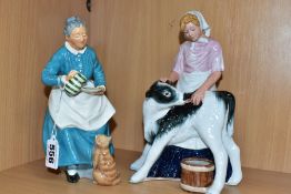 TWO ROYAL DOULTON FIGURINES, The Favourite HN2249 depicting a woman giving a cat a saucer of milk,