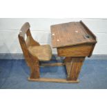 A VICTORIAN PITCH PINE AND ELM CHILDS SCHOOL DESK, with a hinge top lid, width 57cm x depth 88cm x