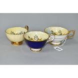 THREE AYNSLEY CABBAGE ROSE TEA CUPS DECORATED BY J.A. BAILEY, comprising pattern no. 1028 with solid