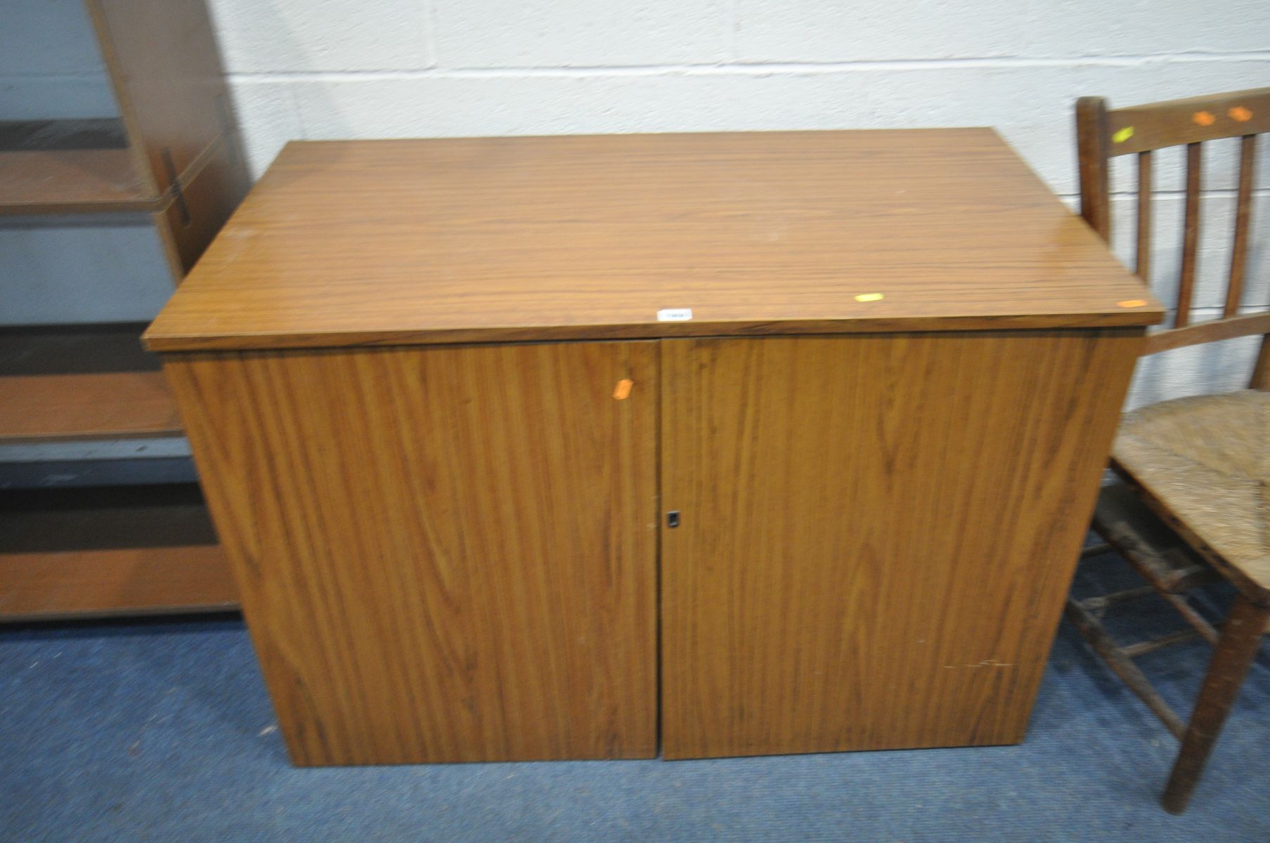 A TEAK FINISH TWO DOOR DESK, enclosing a fitted interior, width 110cm x depth 60cm x height 75cm, an - Image 3 of 5