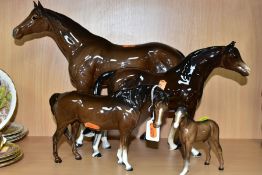 TWO BESWICK BROWN GLOSS HORSES AND A FOAL, TOGETHER WITH ANOTHER UNMARKED BROWN GLOSS HORSE, the