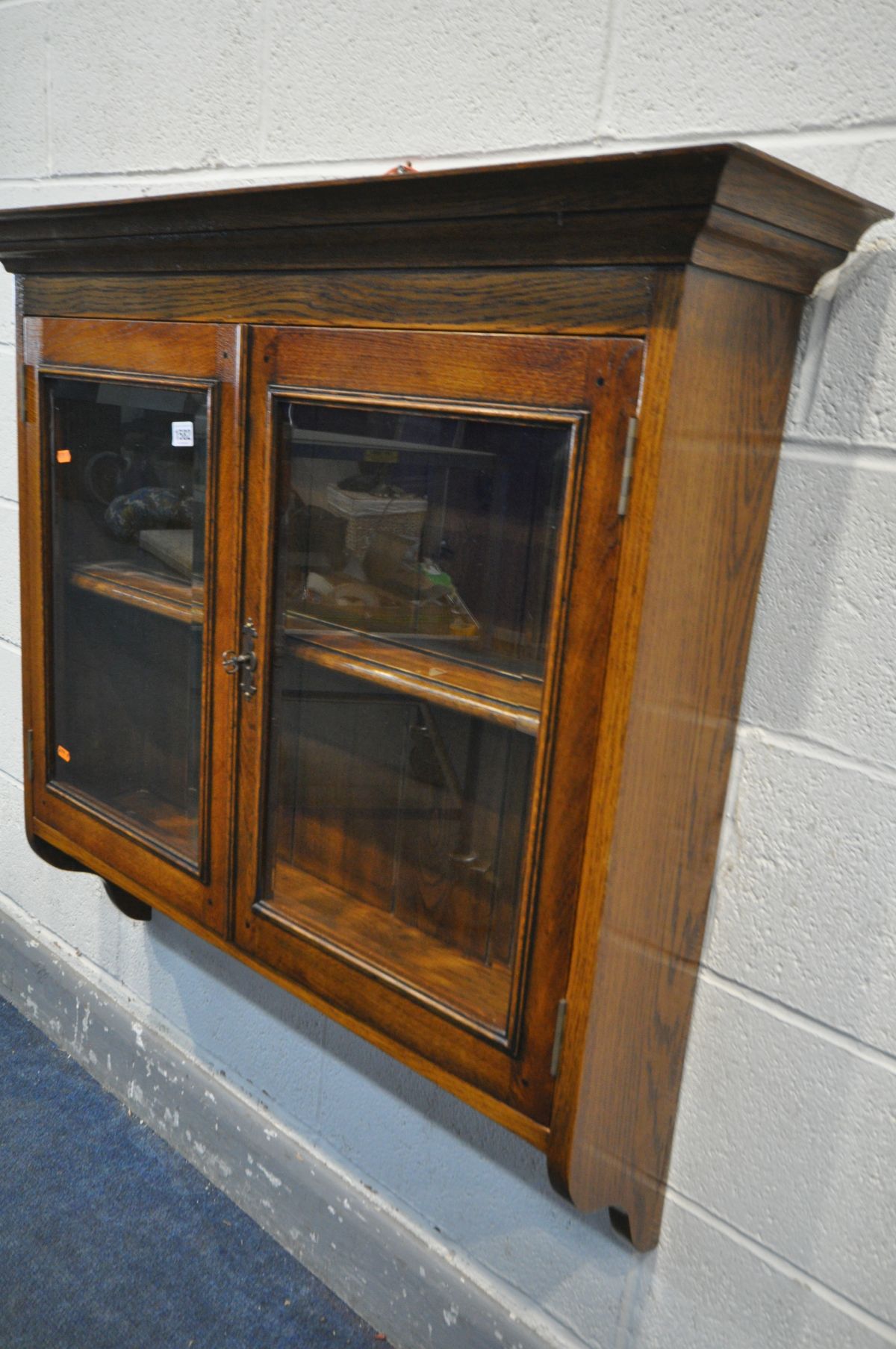 A REPRODUCTION OAK TWO DOOR GLAZED HANGING CABINET, with a single shelf, width 97cm x depth 24cm x - Image 2 of 2