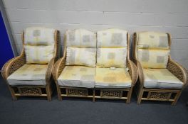 A WICKER THREE PIECE CONSERVATORY SUITE, comprising a two seater settee and a pair of armchairs