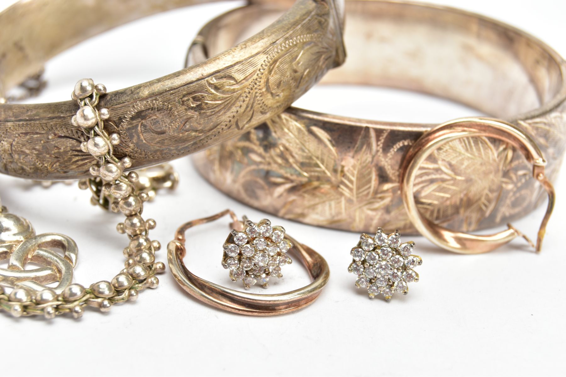 TWO SILVER BANGLES, EARRINGS AND A BRACELET, to include a wide hinged bangle decorated with a floral - Image 2 of 3