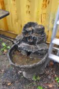 A MODERN COMPOSITE BIRD BATH/FOUNTAIN in the form of a hollowed out tree trunk (no pump) height