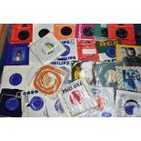 A BOX CONTAINING OVER FIFTY COLLECTABLE 7in SINGLES by artists such as Spencer Davis Group, The