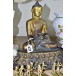 A GILT BRONZE FIGURE OF BUDDHA AND OTHER FIGURES, comprising Buddha figure in traditional seated