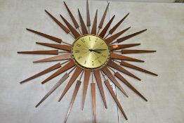 A SETH THOMAS OF SCOTLAND TEAK SUNBURST WALL CLOCK, Arabic numerals, missing one of the metal and