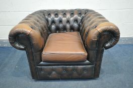 A BROWN LEATHER BUTTONED CHESTERFIELD CLUB ARMCHAIR (condition - some fading to arms, some