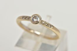 AN 18CT WHITE GOLD DIAMOND RING, centring on a round brilliant cut diamond in a bezel setting,