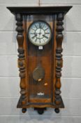 A LATE 19TH CENTURY WALNUT VIENNA WALL CLOCK, the enamel dial with roman numerals and eight day