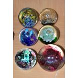 SIX MODERN GLASS PAPERWEIGHTS ALL WITH COLOURED GLASS INCLUSIONS, one by Selkirk Glass titled and