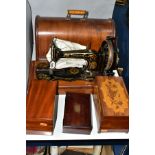 A LATE VICTORIAN SINGER SEWING MACHINE, complete with wooden case, together with drawing instruments