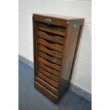 AN EARLY 20TH CENTURY OAK TAMBOUR FRONT FILING CABINET, with ten slides, width 45cm x depth 37cm x