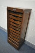 AN EARLY 20TH CENTURY OAK TAMBOUR FRONT FILING CABINET, with ten slides, width 45cm x depth 37cm x