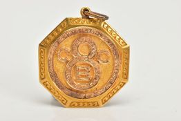 AN EARLY 20TH CENTURY GOLD PENDANT, an octogen shaped medallion style pendant, detailing the letters