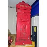 A REPRODUCTION CAST METAL POST BOX, painted red with gilt 'POST' lettering, crown finial and lion