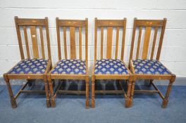 A SET OF FOUR EARLY TO MID 20TH CENTURY OAK DINING CHAIRS (surface marks)