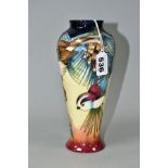 A MOORCROFT POTTERY BALUSTER VASE DECORATED WITH THREE BIRDS IN THE BRANCHES OF A PINE TREE,