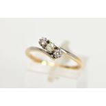 A THREE STONE DIAMOND RING, three round brilliant cut diamonds prong set in white metal, approximate