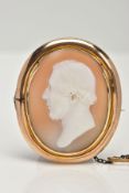 A VICTORIAN CAMEO BROOCH, oval cameo depicting a gentleman in profile, the back has a personal