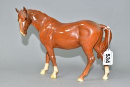 A BESWICK MARE FACING LEFT IN CHESTNUT GLOSS, model no.976 (Condition report: both ears have been