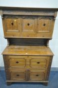 AN EARLY 20TH CENTURY OAK PANTRY CUPBOARD, the top with three cupboard doors above three drawers,