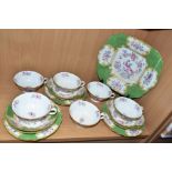 A NINETEEN PIECE MINTONS 'GREEN COCKATRICE' PATTERN TEA SET, pattern 4863, comprising a cake