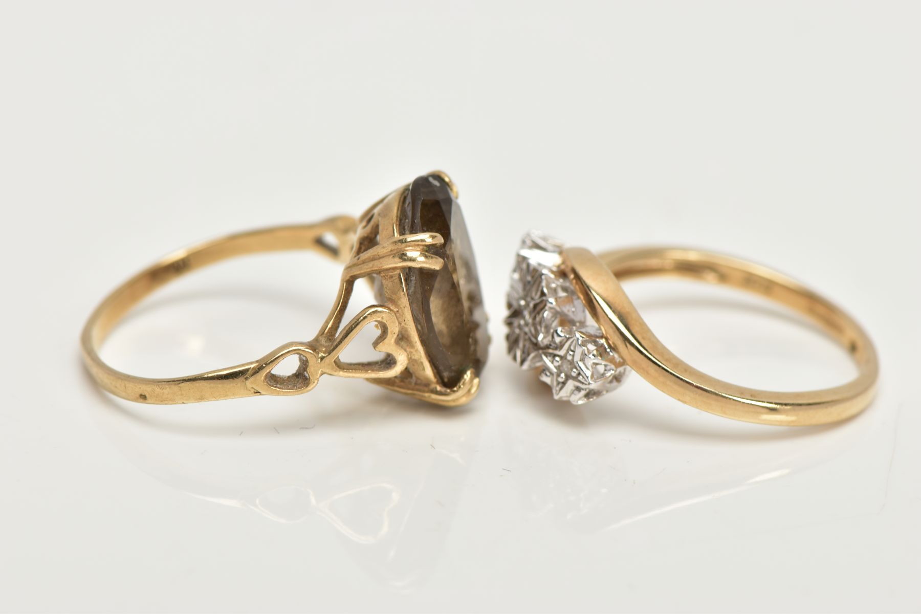 TWO 9CT GOLD RINGS, an oval cut stone assessed as Smokey quartz, prong set in a yellow gold, leading - Image 2 of 4
