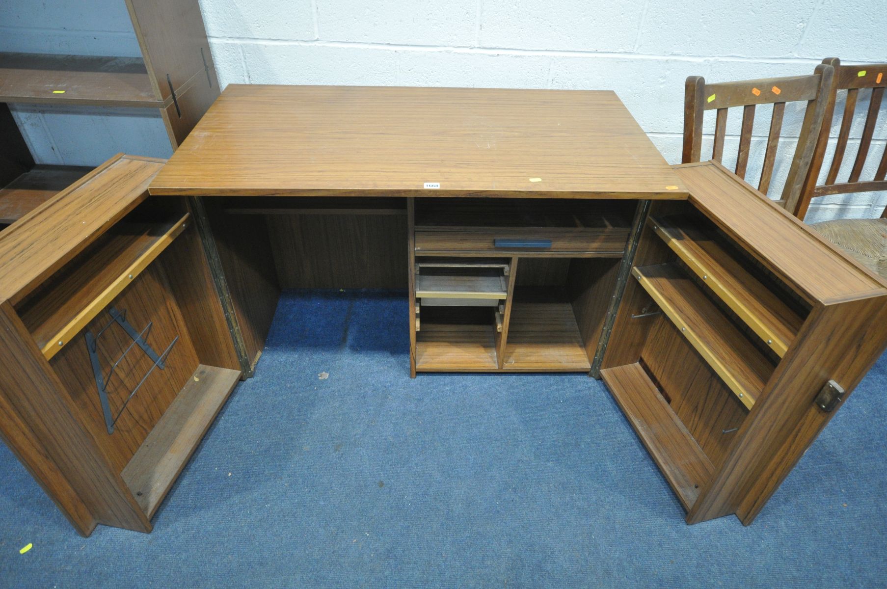 A TEAK FINISH TWO DOOR DESK, enclosing a fitted interior, width 110cm x depth 60cm x height 75cm, an - Image 4 of 5