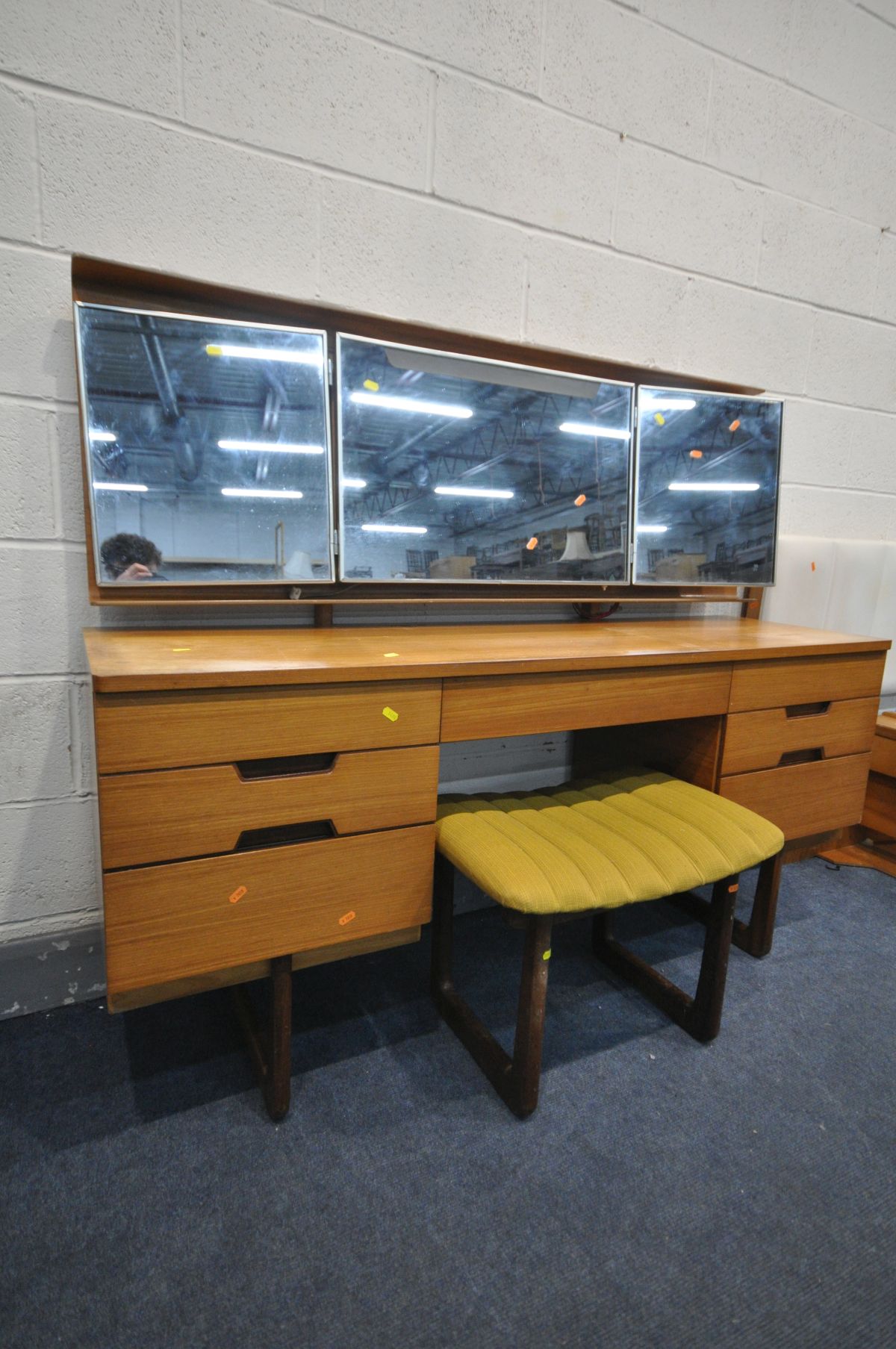A UNIFLEX FIVE PIECE TEAK DRESSING TABLE, with a plywood back enclosing triple mirrors and seven - Image 4 of 7
