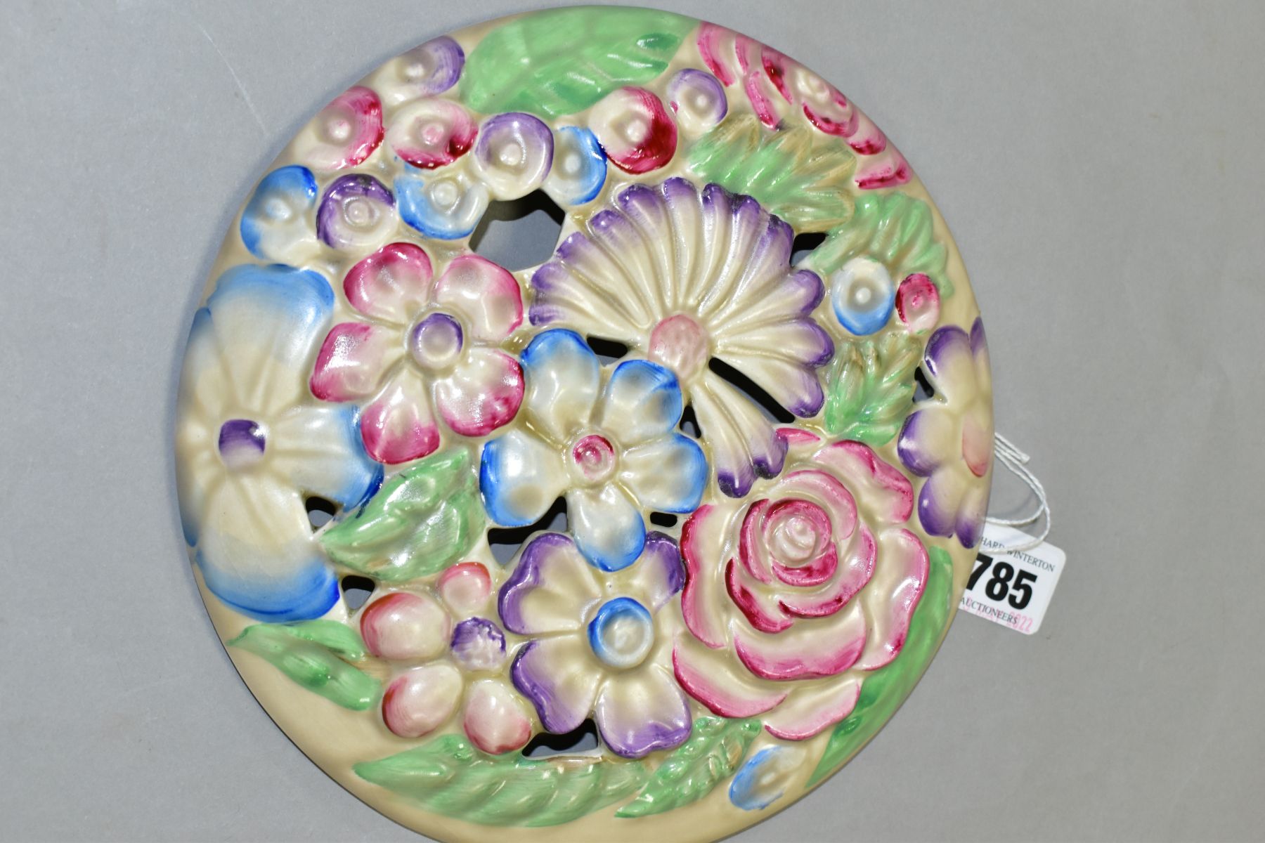 A CLARICE CLIFF WILKINSON LTD CIRCULAR BOUQUET WALL PLAQUE, relief moulded with pastel colour - Image 2 of 4